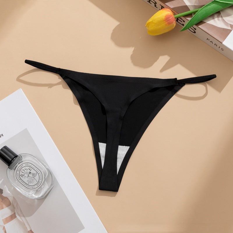  Seamless panties Ice Silk pant in beige color laid flat with a floral accent and a bottle of perfume.