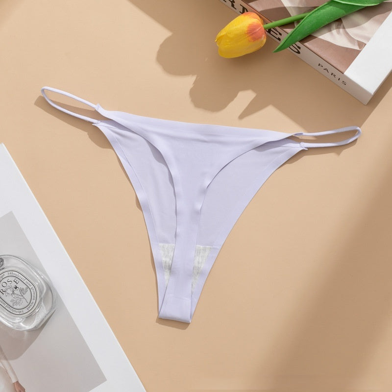  Seamless panties Ice Silk pant in beige color laid flat with a floral accent and a bottle of perfume.